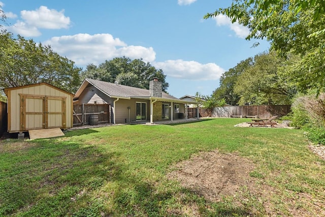 view of yard featuring a patio area and a storage shed