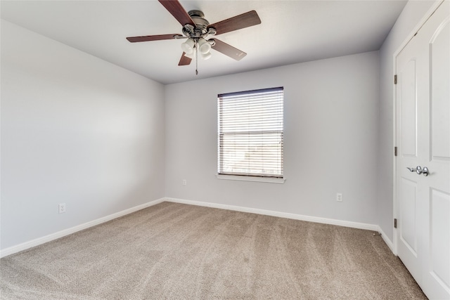 unfurnished bedroom featuring ceiling fan and light colored carpet