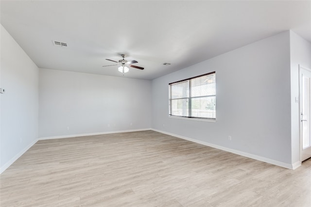 unfurnished room featuring light wood-type flooring and ceiling fan