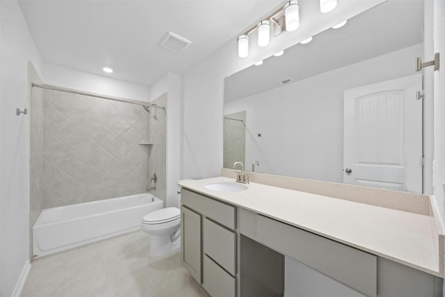 full bathroom featuring vanity, toilet, and tiled shower / bath