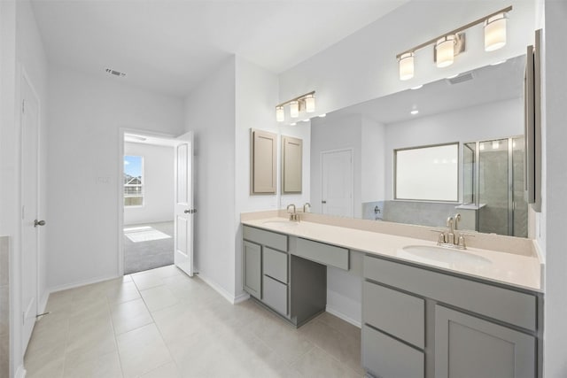 bathroom with tile patterned flooring and vanity