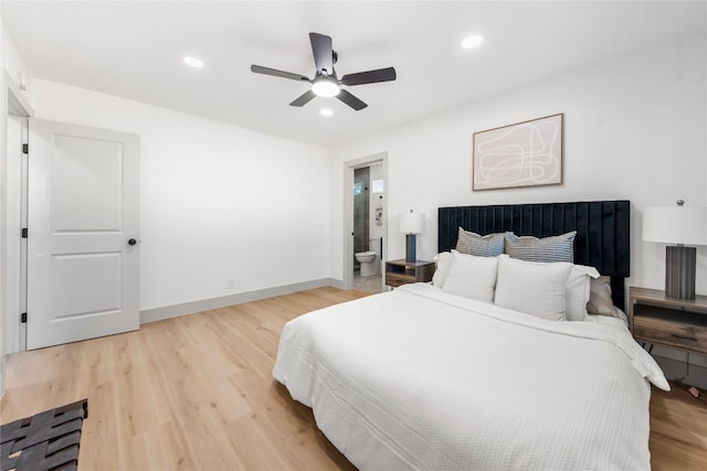 bedroom with wood-type flooring, ensuite bath, and ceiling fan