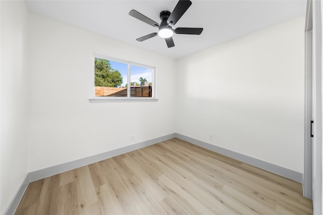 unfurnished room featuring light hardwood / wood-style flooring and ceiling fan