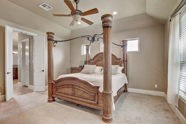 carpeted bedroom with vaulted ceiling and ceiling fan