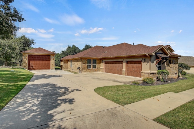 view of front facade with a front yard and a garage