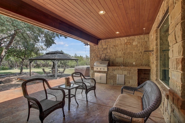 view of patio / terrace featuring area for grilling and a gazebo