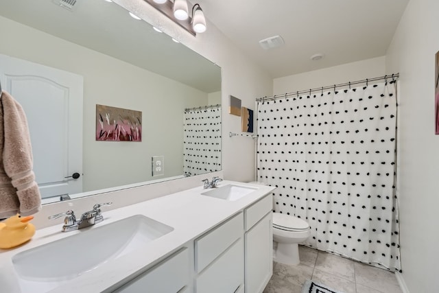 bathroom featuring a shower with curtain, toilet, tile patterned floors, and vanity