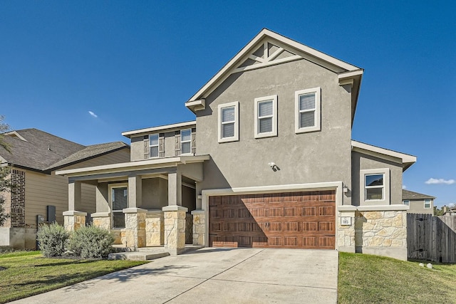 view of front facade with a front yard and a garage