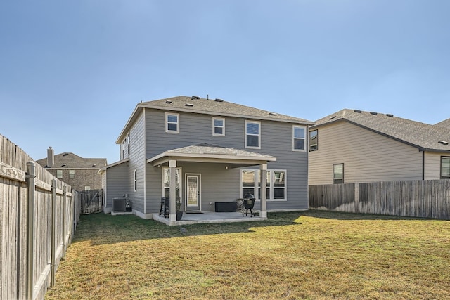 back of property featuring central air condition unit, a yard, and a patio