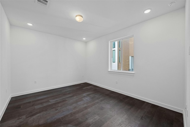 empty room featuring dark hardwood / wood-style floors