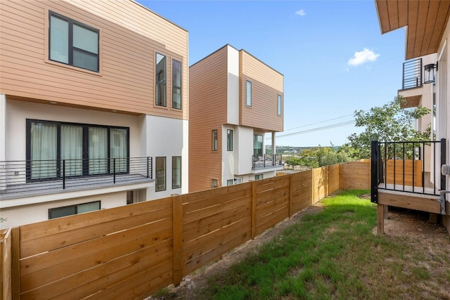 view of side of home featuring a lawn