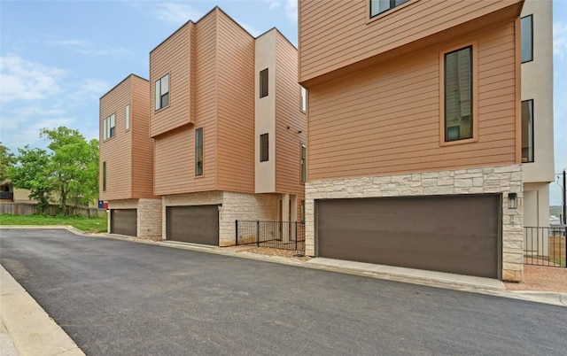 6821 Wolfcreek Pass Unit 12, Austin, TX 78749 - view of building exterior featuring an attached garage