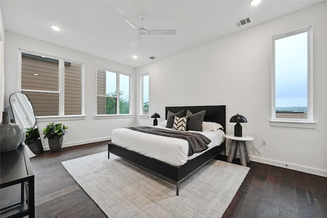 6821 Wolfcreek Pass Unit 12, Austin, TX 78749 - bedroom featuring baseboards, multiple windows, recessed lighting, and wood finished floors
