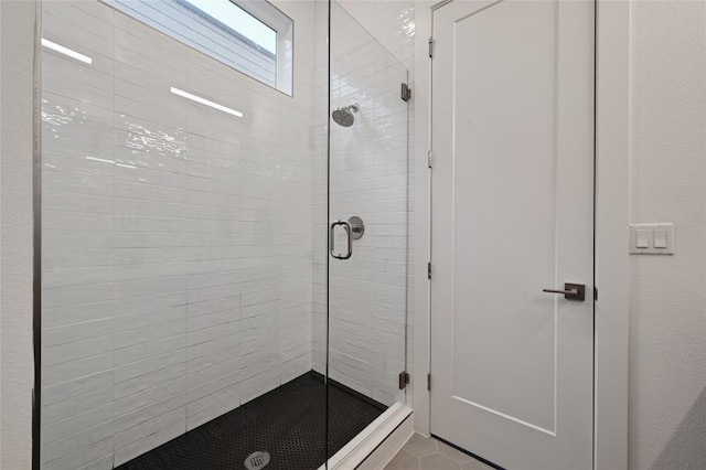 6821 Wolfcreek Pass Unit 12, Austin, TX 78749 - bathroom with a stall shower and tile patterned floors