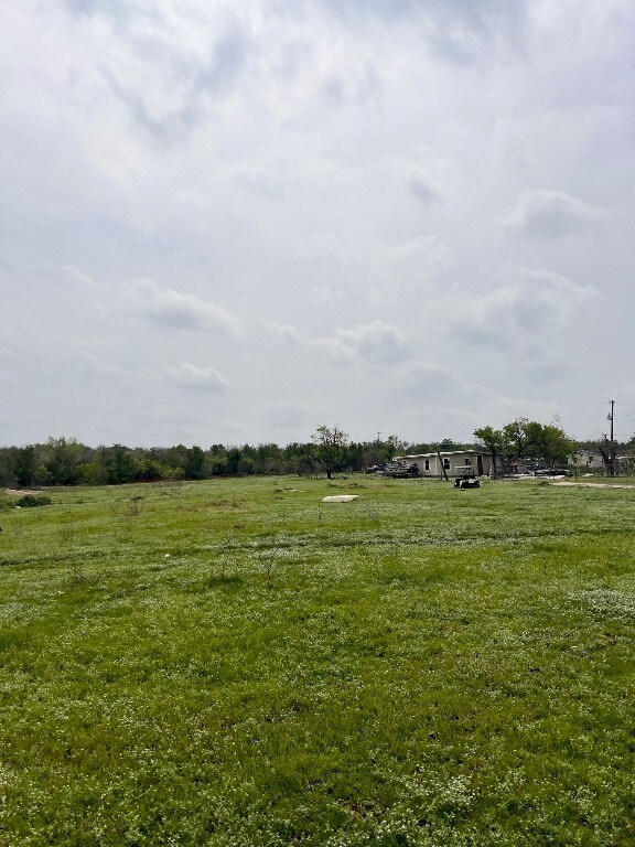 view of yard with a rural view