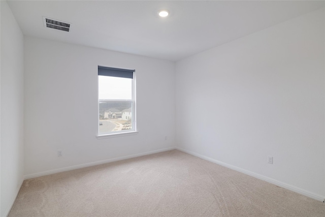 empty room featuring carpet flooring