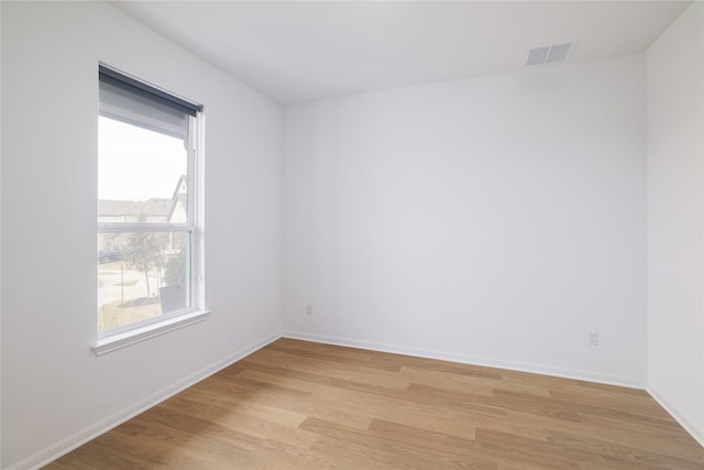 empty room with light wood-type flooring