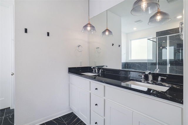 bathroom with an enclosed shower and vanity