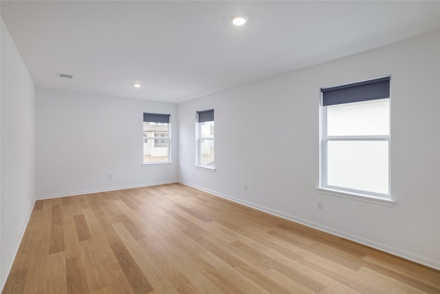 spare room with light wood-type flooring