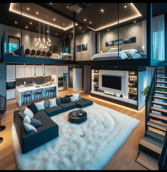 living room featuring light wood-type flooring and a chandelier