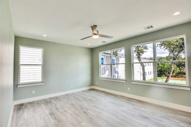 unfurnished room featuring light wood-type flooring and ceiling fan