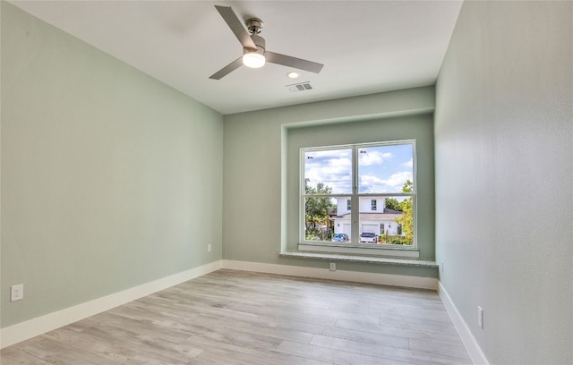 unfurnished room featuring light hardwood / wood-style floors and ceiling fan