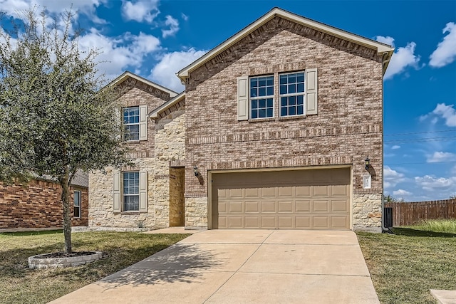 front facade with a front lawn and a garage