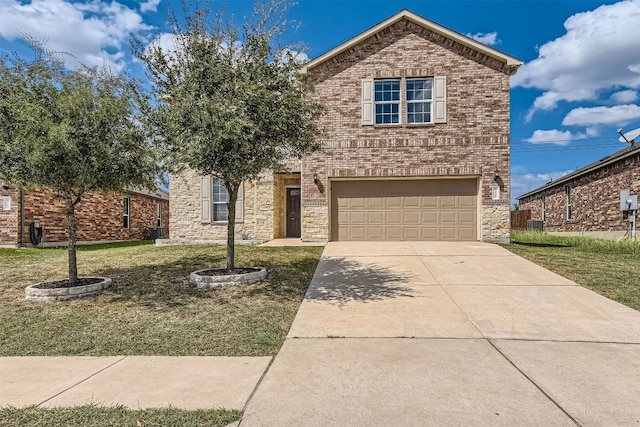 front of property with a front yard and a garage