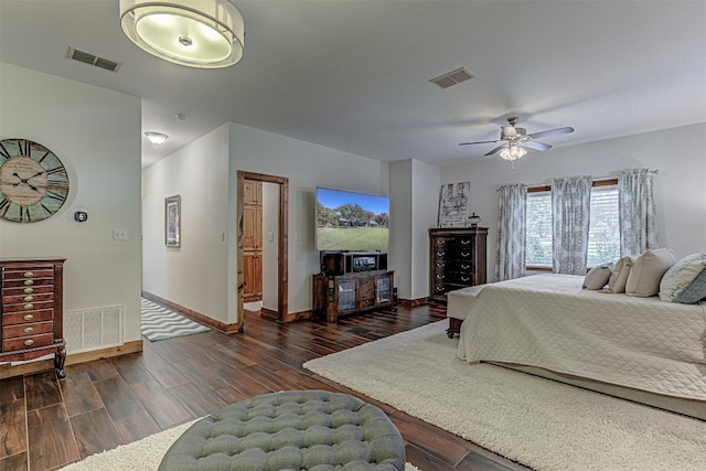 bedroom with dark hardwood / wood-style floors and ceiling fan