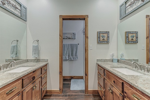 bathroom featuring wood-type flooring and vanity