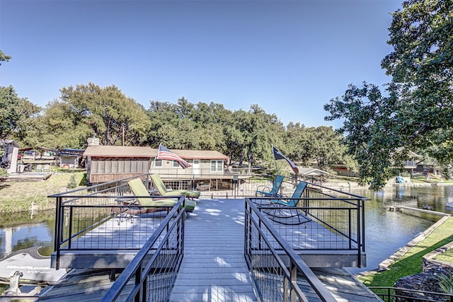 dock area with a deck with water view