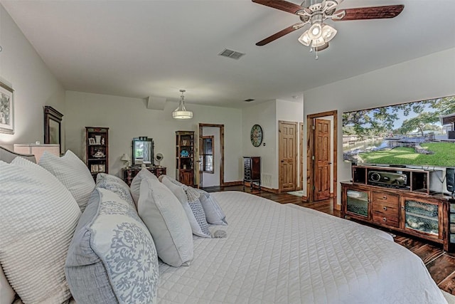 1104 Hill Circle W Dr, Granite Shoals, TX 78654 - bedroom featuring wood finished floors and a ceiling fan