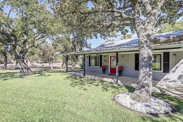 view of front of property with a front lawn