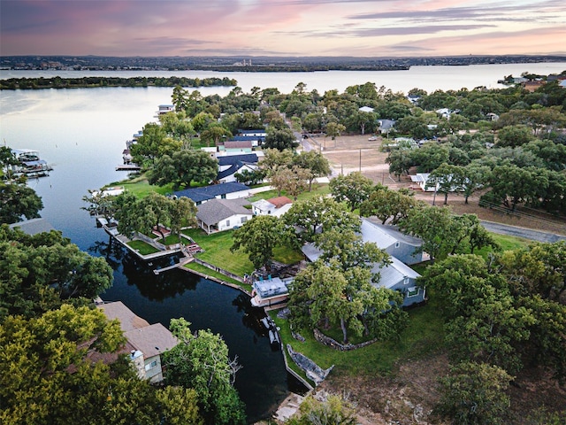 aerial view at dusk with a water view