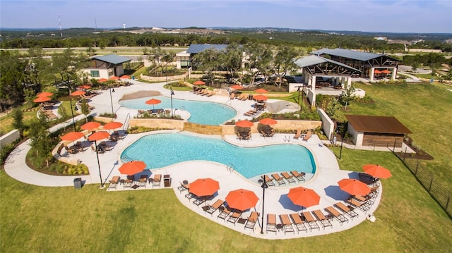 view of pool featuring a yard and a patio