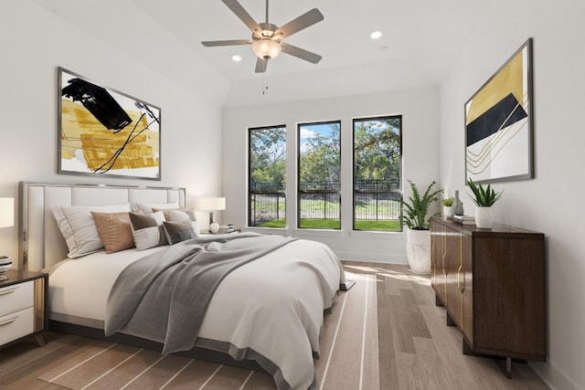 bedroom with hardwood / wood-style floors and ceiling fan