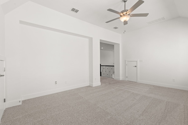 carpeted spare room with lofted ceiling and ceiling fan