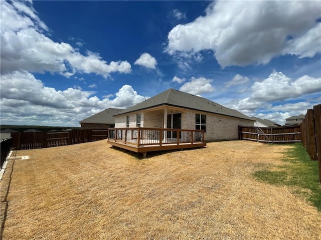 back of property with a deck