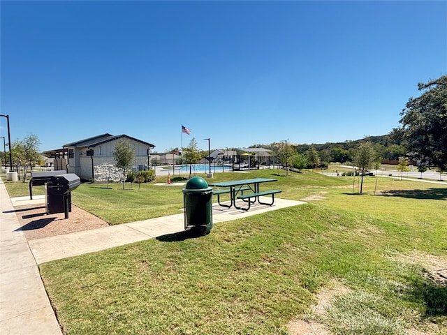 view of home's community featuring a lawn