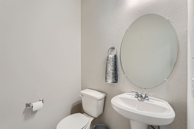 bathroom with sink and toilet