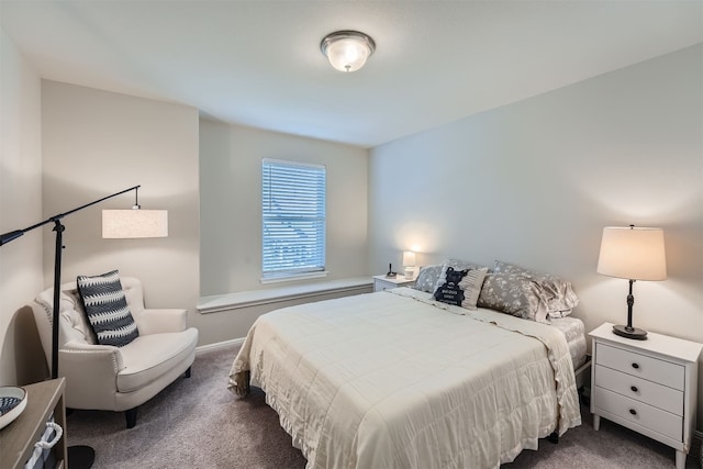 bedroom with dark carpet