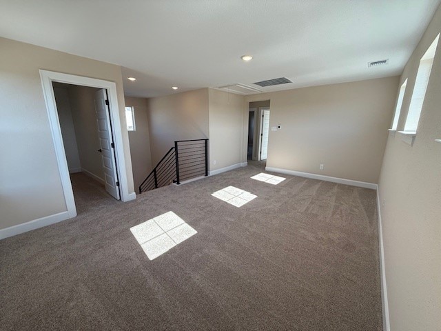 spare room featuring carpet flooring