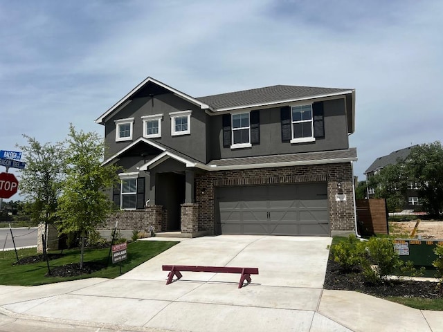 552 Raleigh Dr, Georgetown, TX 78633 - craftsman inspired home featuring roof with shingles, stucco siding, concrete driveway, brick siding, and a garage