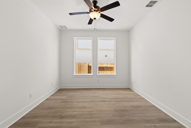 spare room with ceiling fan and light hardwood / wood-style floors