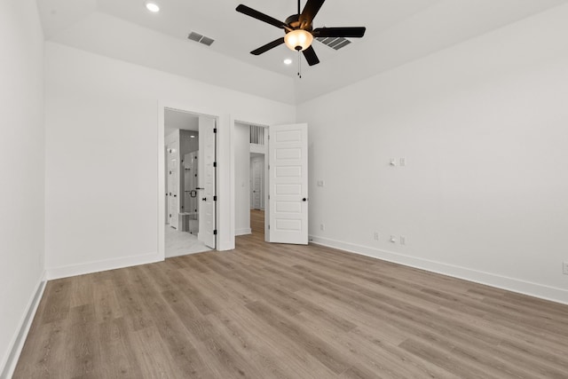 unfurnished bedroom with light hardwood / wood-style flooring, ceiling fan, and ensuite bathroom