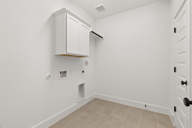 laundry area with gas dryer hookup, cabinets, hookup for a washing machine, and electric dryer hookup