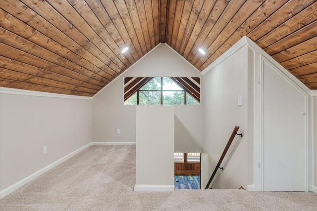 bonus room featuring wooden ceiling, vaulted ceiling, and light colored carpet