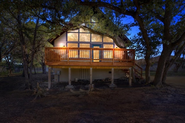 back of house with stairs and a wooden deck