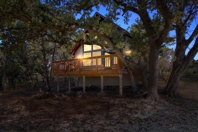 back of property featuring a wooden deck