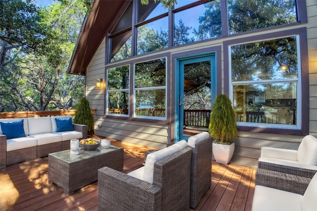 wooden deck with an outdoor living space